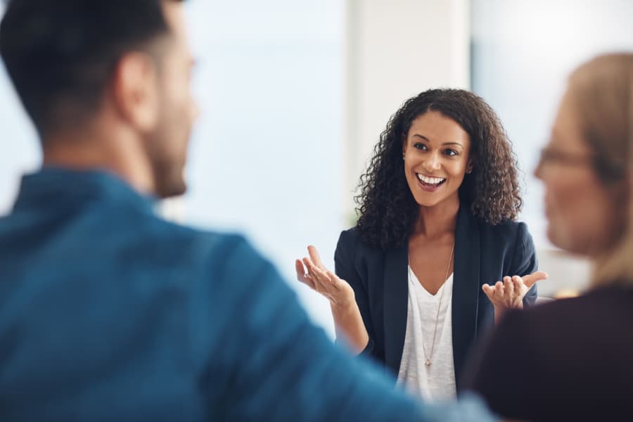 Mediator talking to couple and smiling