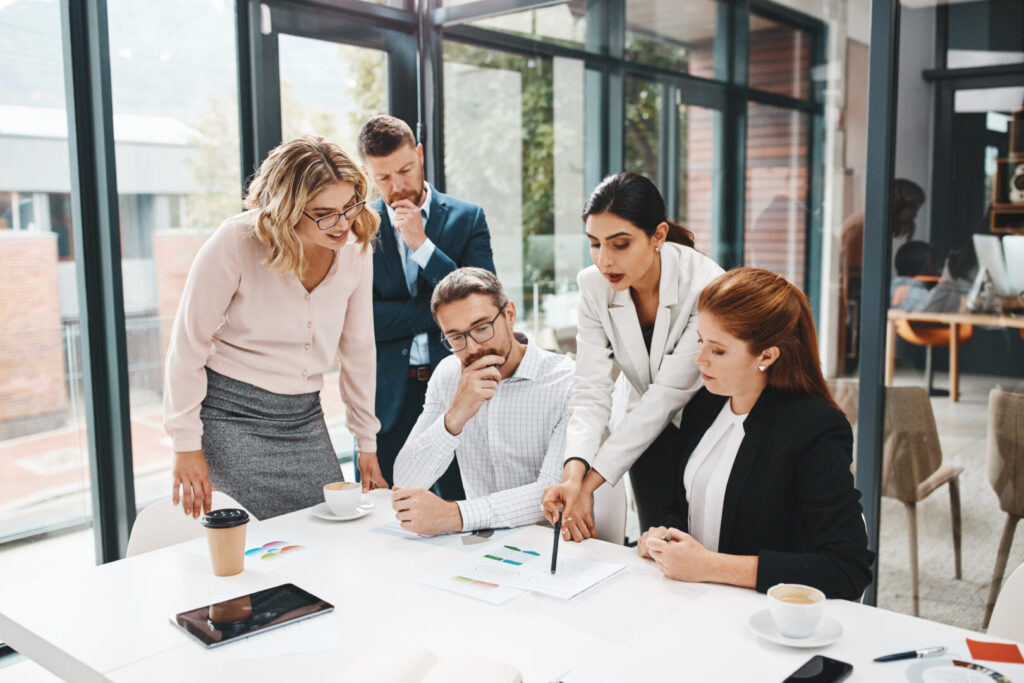 Business, employees and office with documents for strategy with teamwork and collaboration for company growth. Boardroom, people and project managers with report, feedback and results for progress.