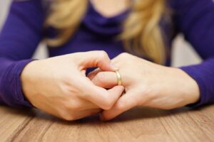 close up of woman playing with wedding ring on finger